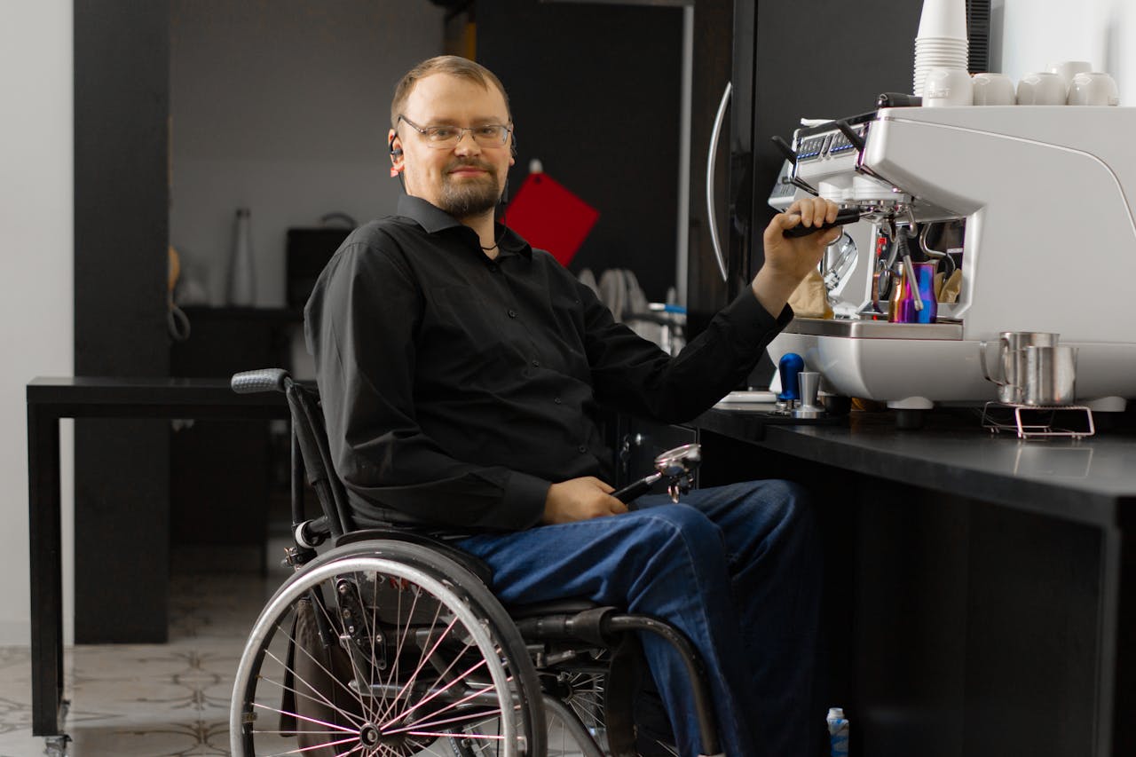 A Man in Black Long Sleeves Sitting on a Wheelchair